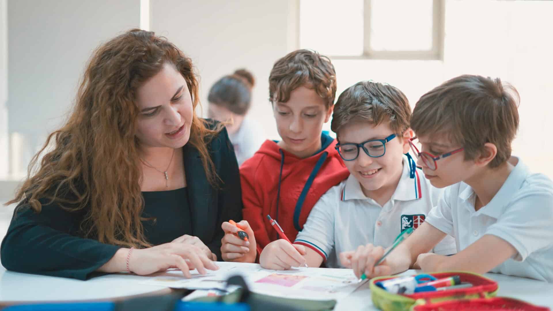 International school tuition fees are set by campus and grade level; a learning moment in class